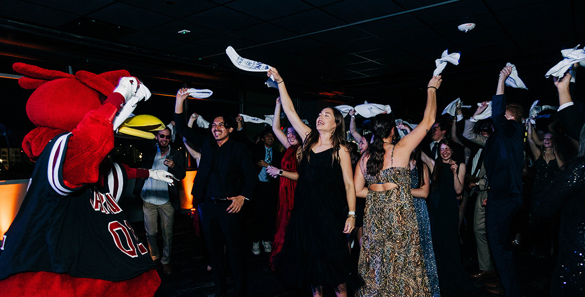 Students dancing with Cocky at the Honors Gala