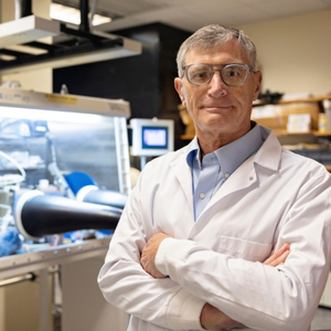 Ted Besmann poses for a portrait in his science lab on USC's campus.